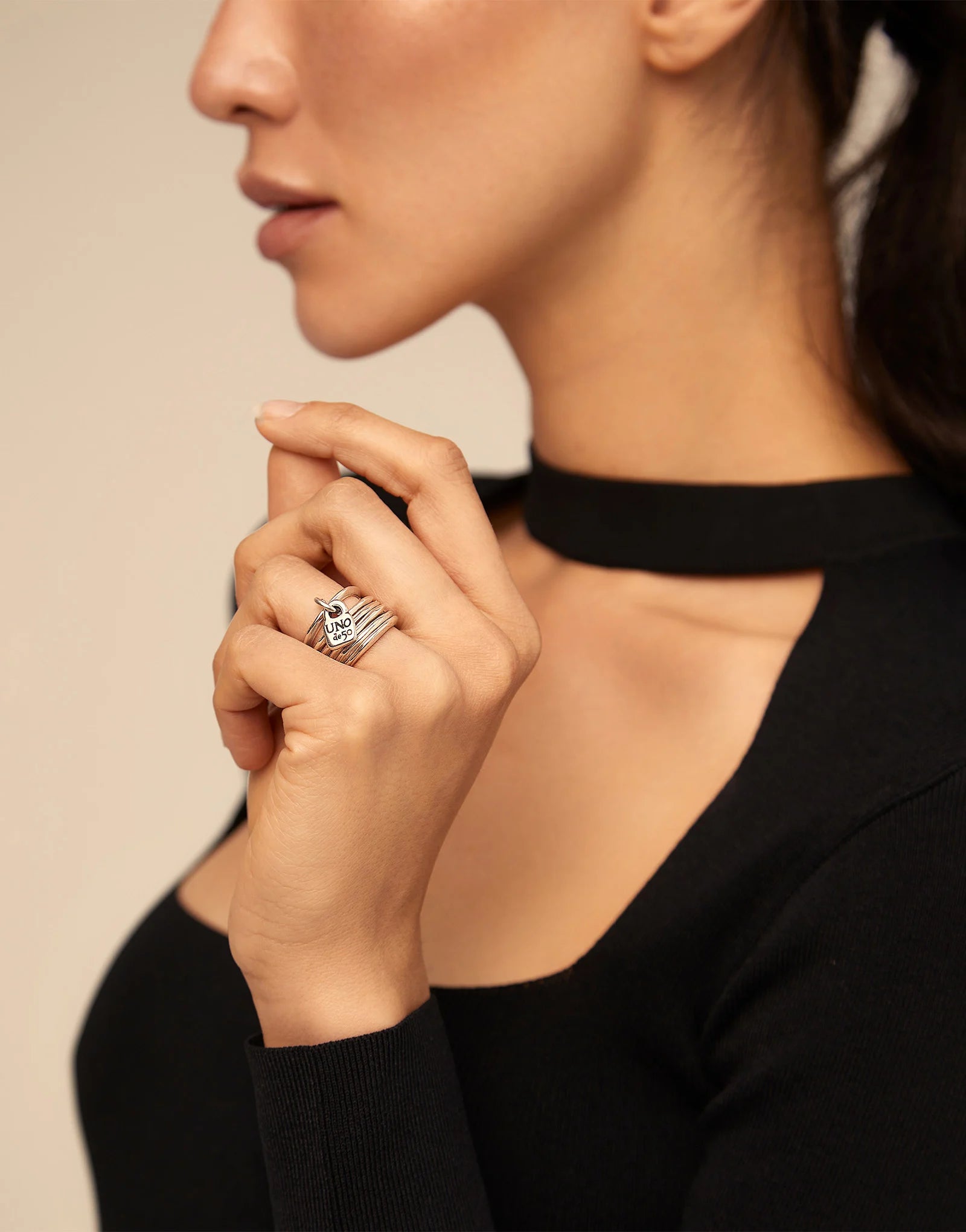 Multi row ring with a charm